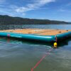 Retrospec Siesta Dock XL Inflatable Platform 10' floating on a mountain lake with an anchor rope attached.