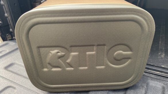 Close-up bottom view of the RTIC Ultra-Tough Soft Cooler 30 can option on the tailgate of a pickup.