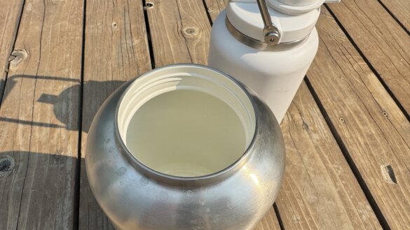 Closeup of the rim of the 1-gallon RTIC Outback Jug showing the ceramic-lined interior.