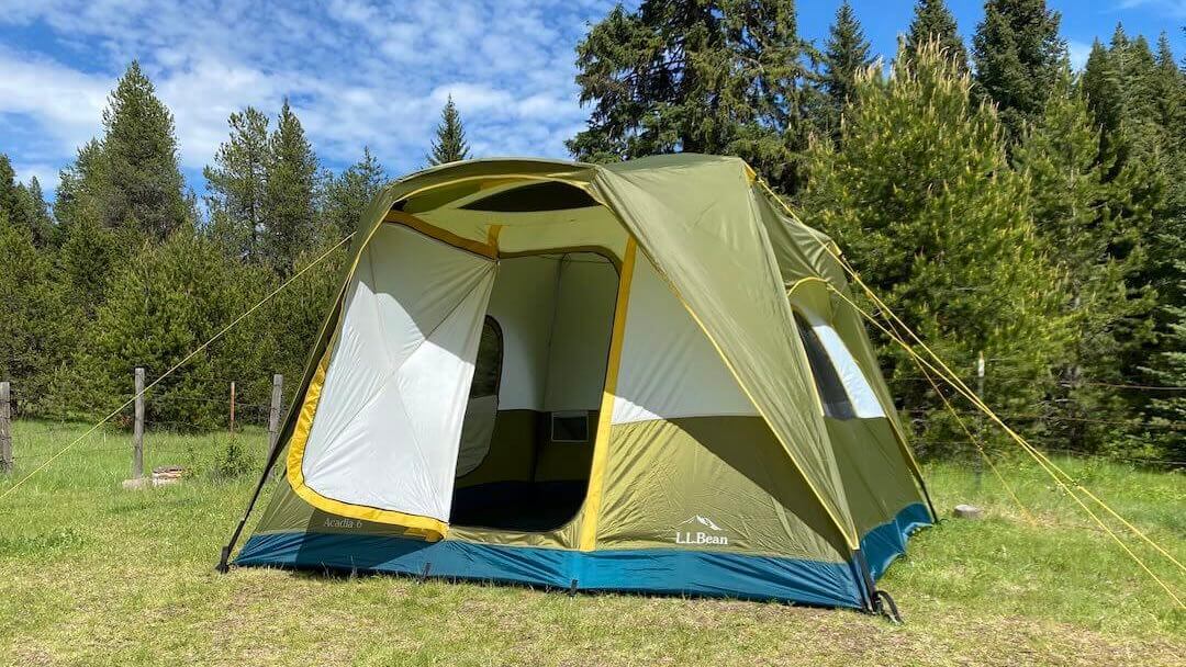 Acadia 6-person Family Camping Tent pitched in a meadow with the self-closing door propped open during testing.